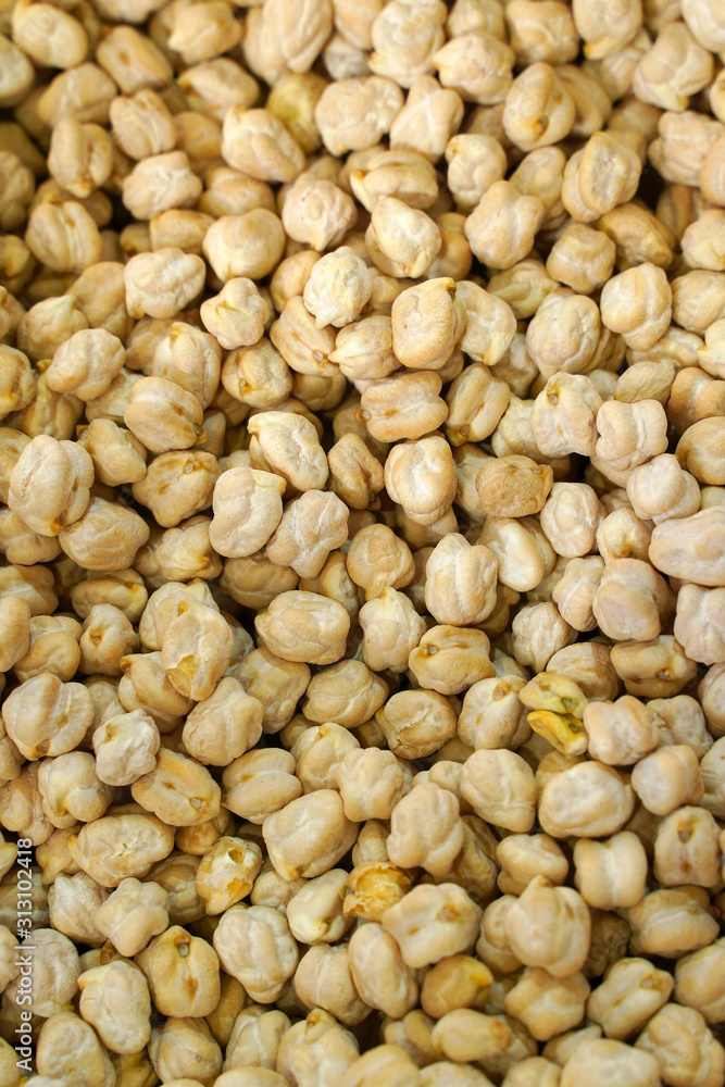 food background from a texture of raw chickpeas close-up. selective focus 