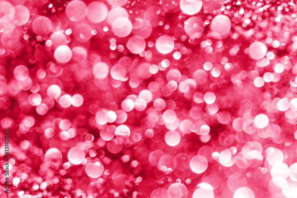 Pink bokeh shiny glitter background. Abstract vibrant color glowing white spots texture for graphic design.
