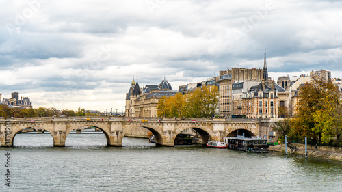 View from Pont des arts and Seine river during Autumn season in the afternoon cloudy day . One of the most important bridge in the heart of Paris , France
