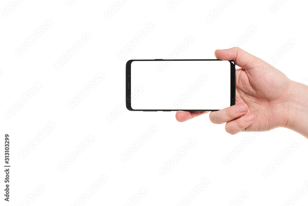 Man hand holding the black smartphone blank screen with modern frameless design isolated on white background Man hand holding the black smartphone blank screen with modern frameless design isolated on white background