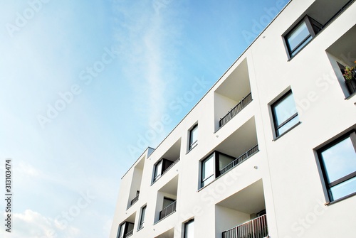 Modern apartment buildings on a sunny day with a blue sky. Facade of a modern apartment building