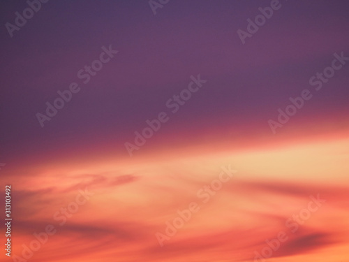 Sunset, winter, pink purple red sky and clouds background texture photo