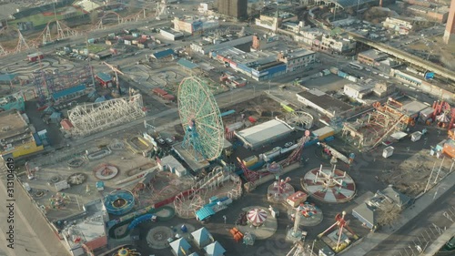 Aerial Descending Drone Shot of Coney Island Ferris Wheel and Amusement Park