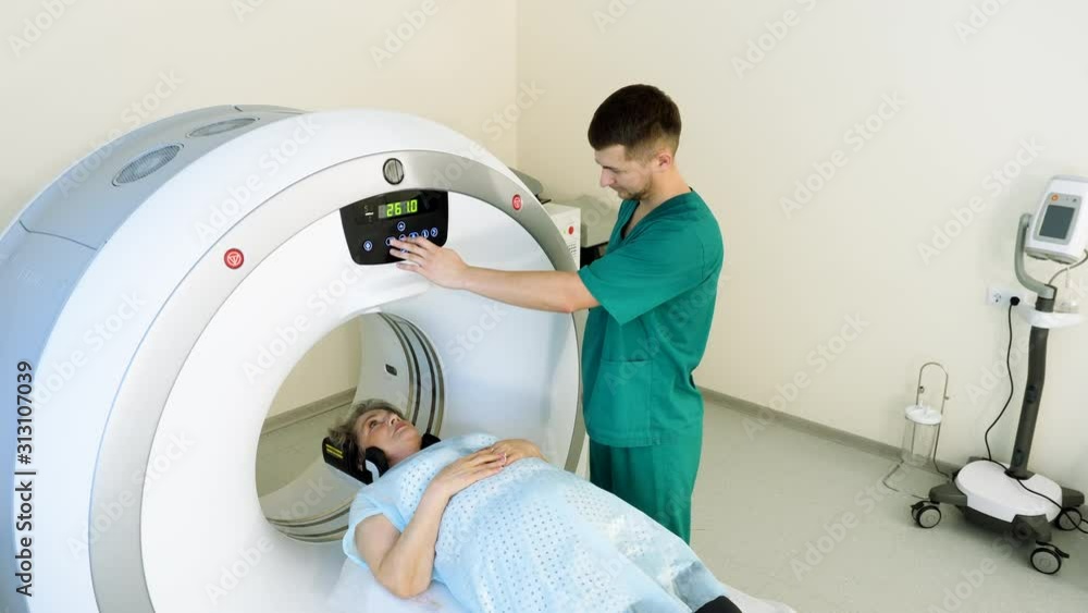 Procedure of computer tomography or magnetic resonance imaging. Elderly female patient on medical examination. CT or MRI scan. 4K Procedure of computer tomography or magnetic resonance imaging. Elderly female patient on medical examination. CT or MRI scan. 4K
