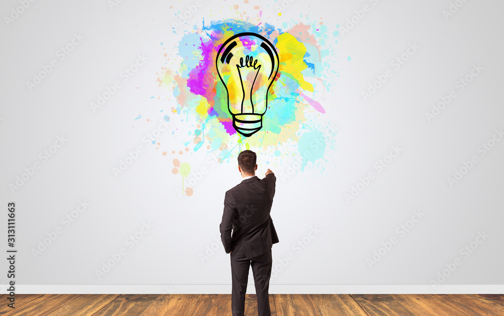 Businessman looking to a wall with new idea concept Businessman looking to a wall with new idea concept