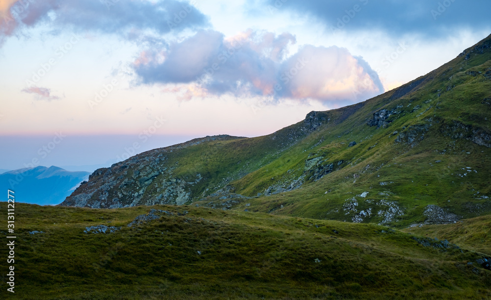 Fototapeta premium Sunrise on Fagaras high mountain ridge. Romanian mountain landscape with high peaks over 2200m
