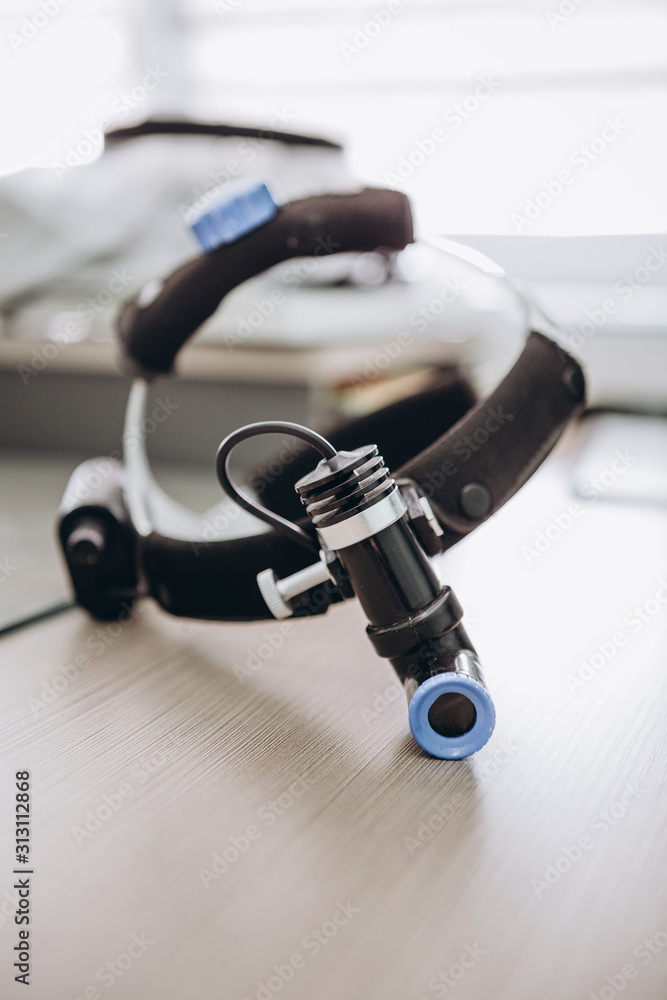 03.09.2019 Kyiv, Ukraine: professional surgeon mask with all necessary for the operation of modern light, camera. Selective focus, noise effect 03.09.2019 Kyiv, Ukraine: professional surgeon mask with all necessary for the operation of modern light, camera. Selective focus, noise effect