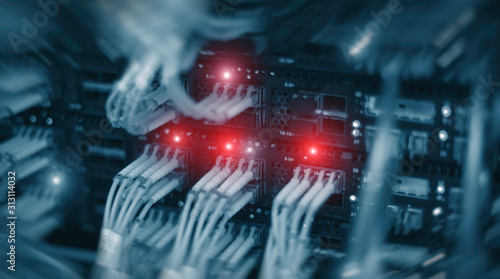 Optical Server Rack .Blue background with red lights.