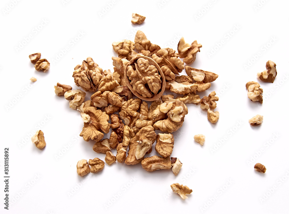 Obraz premium The purified kernel of a walnut isolated on a white background. Set or collection. The view from the top.