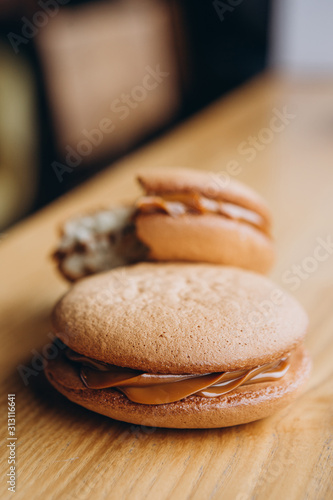 Close up Traditional chocolate and Pumpkin Whoopie pies made with vanilla cream cheese. Background for bakeries, cafes, restaurants photo