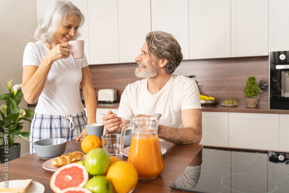 Man at the table smiling at his wife Man at the table smiling at his wife