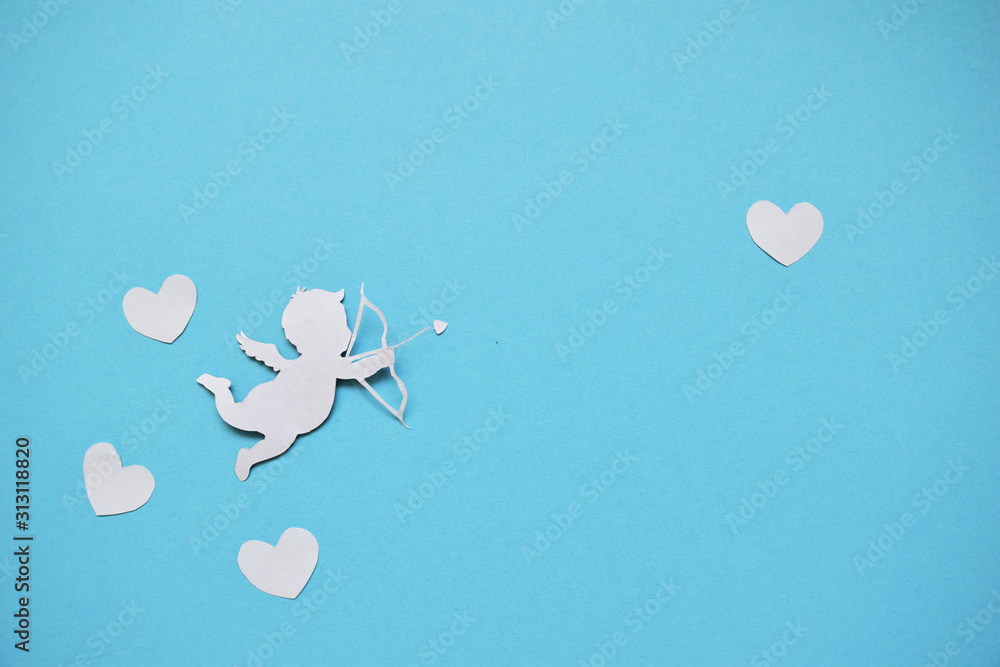 valentines day consept. white hearts and cupid aiming in heart on blue background. valentines day cards. flat lay