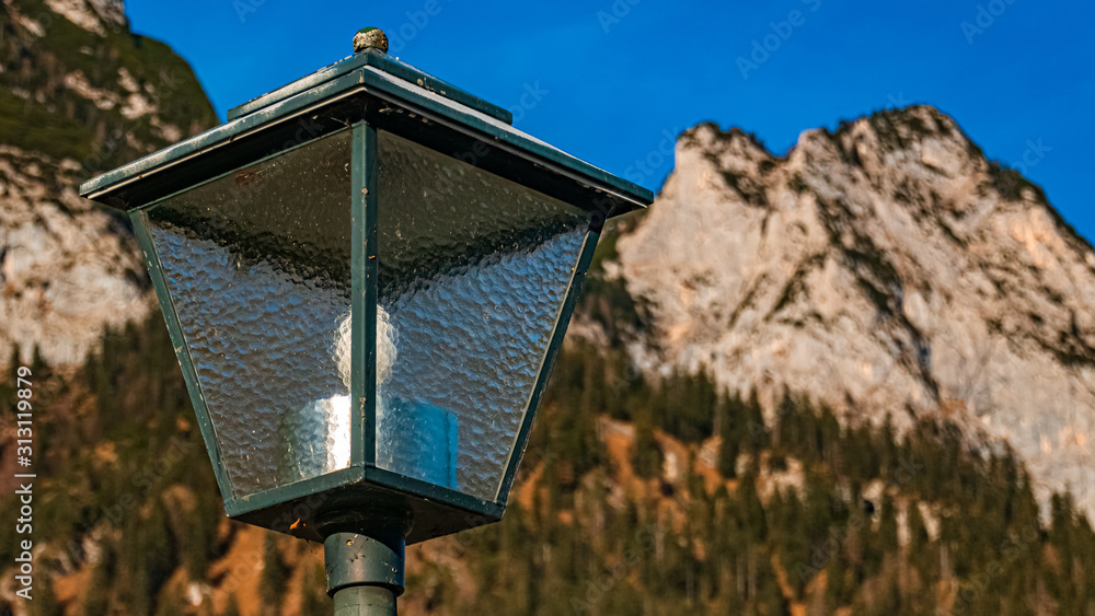 Beautiful alpine view with details of a street lamp at the famous Hintersee, Ramsau, Berchtesgaden, Bavaria, Germany Beautiful alpine view with details of a street lamp at the famous Hintersee, Ramsau, Berchtesgaden, Bavaria, Germany