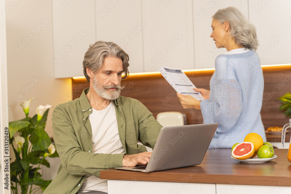 Serious attractive man checking his email box Serious attractive man checking his email box