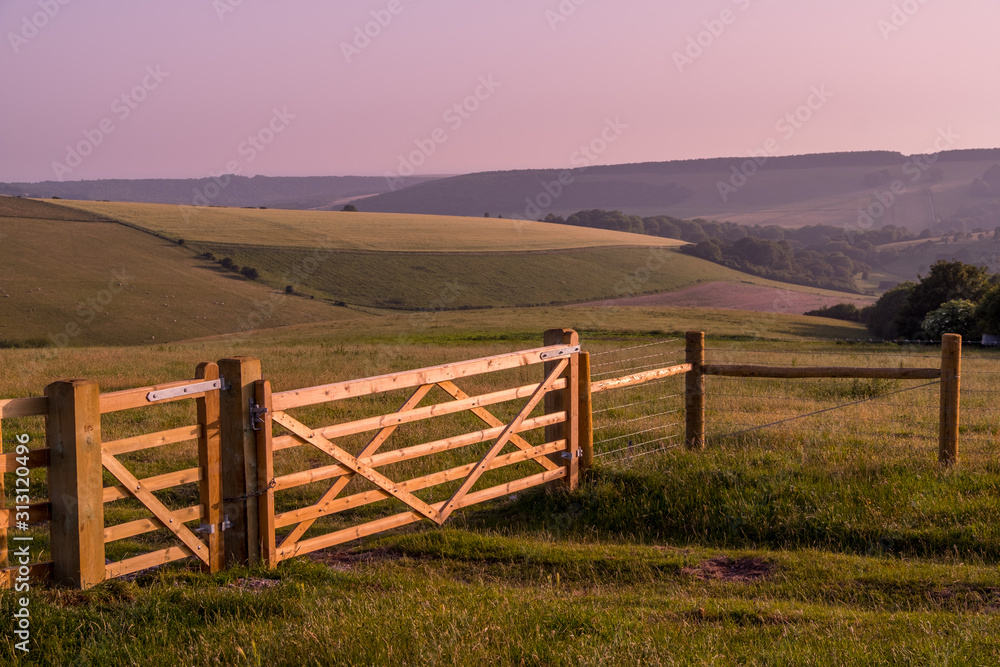 rural landscape with fence and clear sky before sunset rural landscape with fence and clear sky before sunset