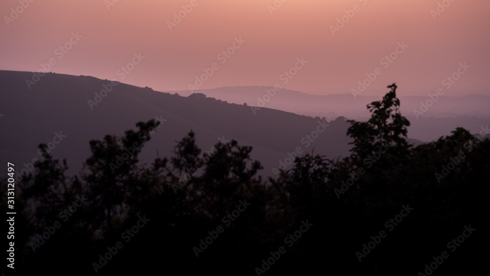 Hills in East Sussex with layers of mist viewed from Butts Brow in the South Downs National Park Hills in East Sussex with layers of mist viewed from Butts Brow in the South Downs National Park