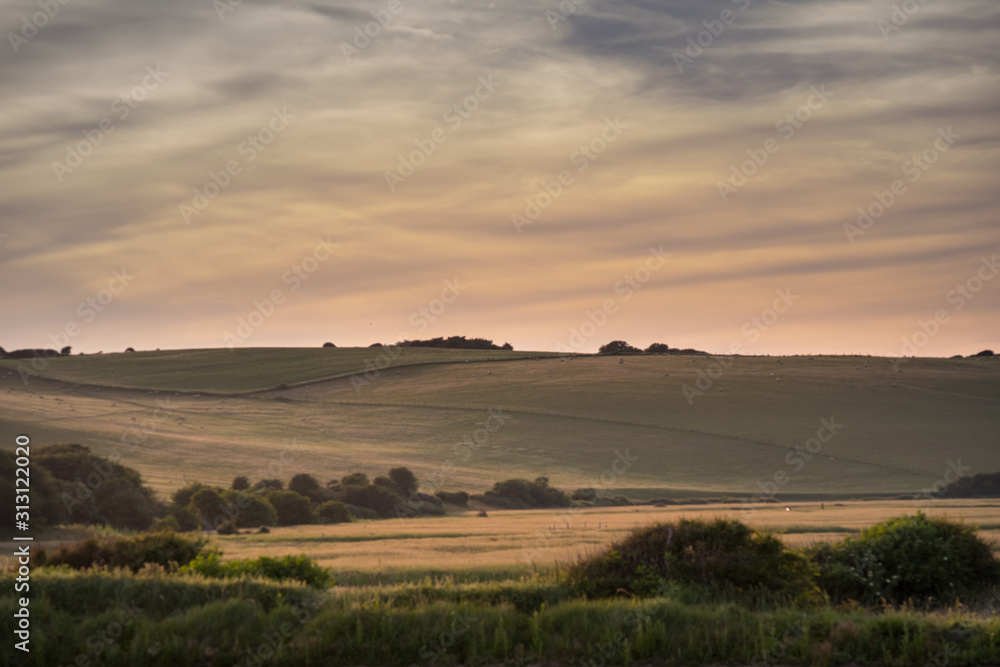 Sunset skies over fields in Cuckmere, East Sussex