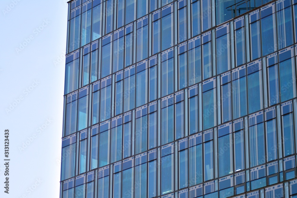 The windows of a modern building for offices. Business buildings architecture. The windows of a modern building for offices. Business buildings architecture.