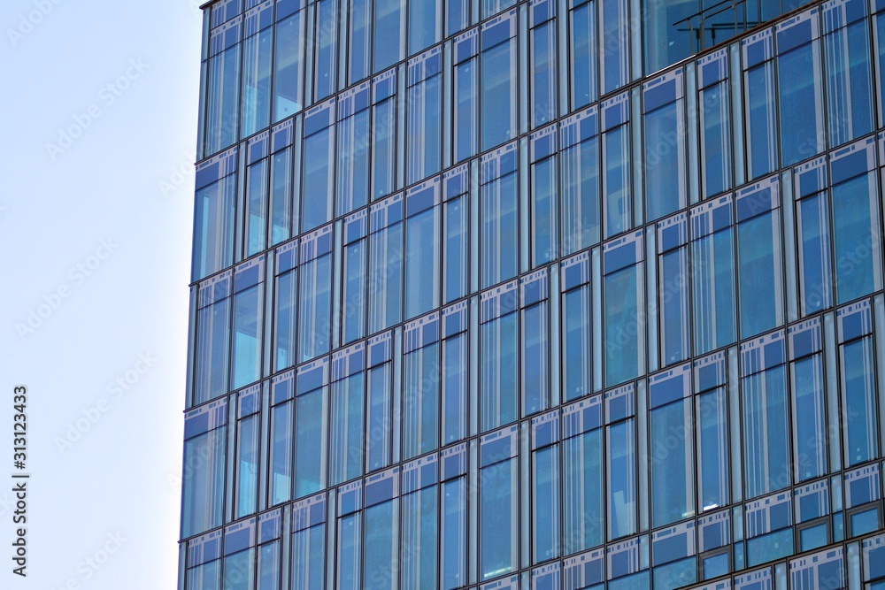 The windows of a modern building for offices. Business buildings architecture.