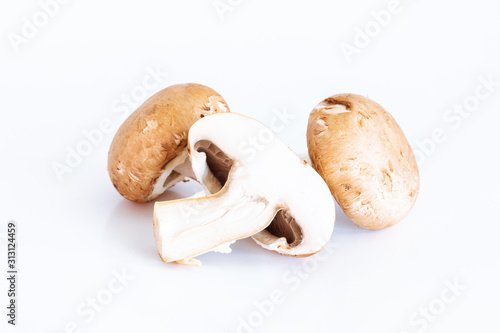 Fresh champignon mushrooms on white background, Isolated food and nature object