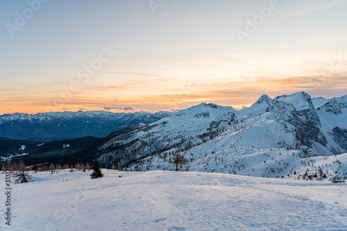 Spectacular winter mountain panoramic view of mountains at sunset.