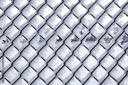 Hoar frost on a chain link fence