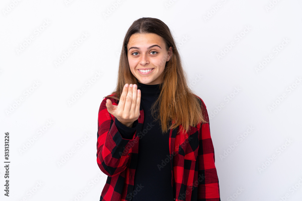Teenager girl over isolated white background inviting to come with hand. Happy that you came Teenager girl over isolated white background inviting to come with hand. Happy that you came