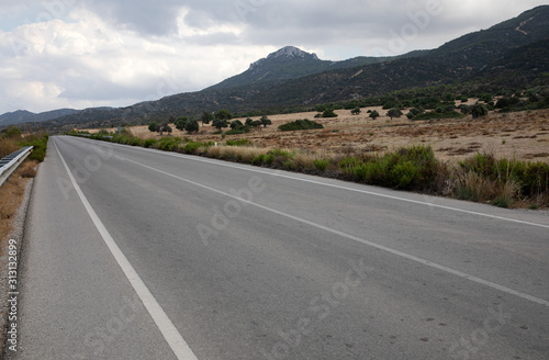 Road in Northern Cyprus. Landscape with road stretches into the distance against the backdrop of mountains