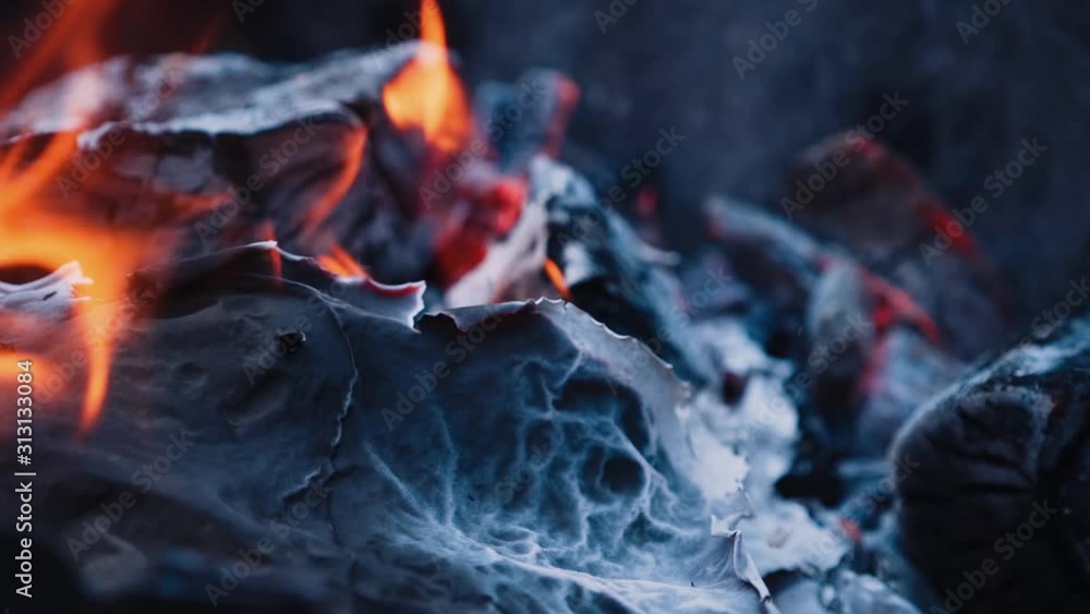 Burning paper. Bonfire. Burning logs in orange flames. Slow motion Burning paper. Bonfire. Burning logs in orange flames. Slow motion