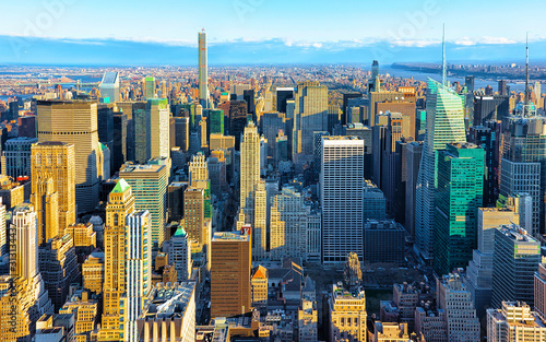 Aerial panoramic view. on Midtown district of Manhattan in New York. Hudson river is on the background. Metropolitan City skyline  USA. American architecture building. Panorama of Metropolis NYC