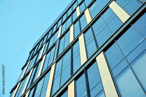 The windows of a modern building for offices. Business buildings architecture.