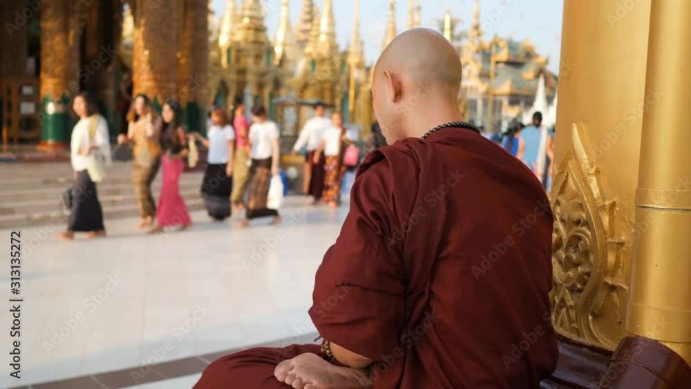 Unrecognizable Asian Monk Fingering Prayer Beads in Buddhist Temple. 4K Slowmotion Religion Concept Footage. Yangon, Myanmar.