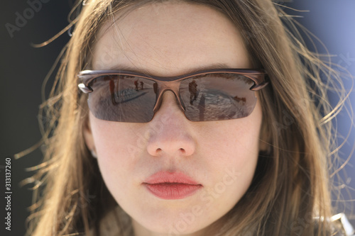 beautiful asian female face close-up in sunglasses