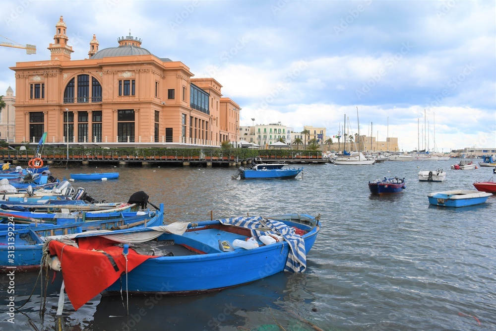 Little Harbor with wooden boats and theater in the background, Bari, Puglia, Italy