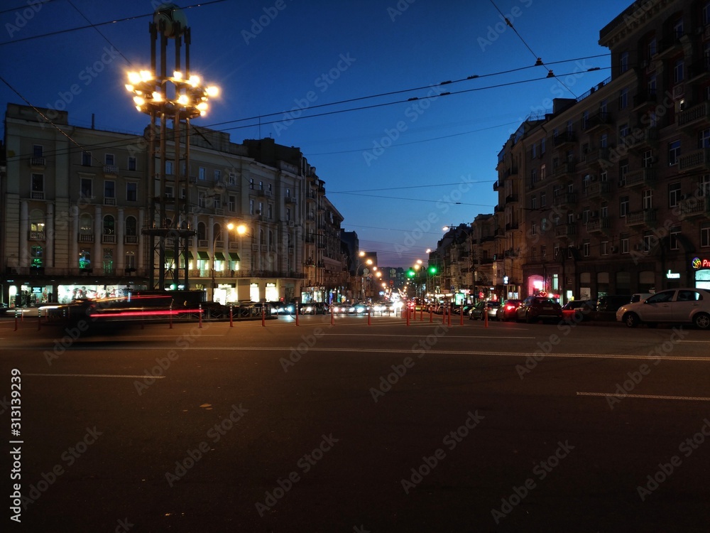Kiev Leo Tolstoy Square, evening lights, street traffic, blue hour evening.