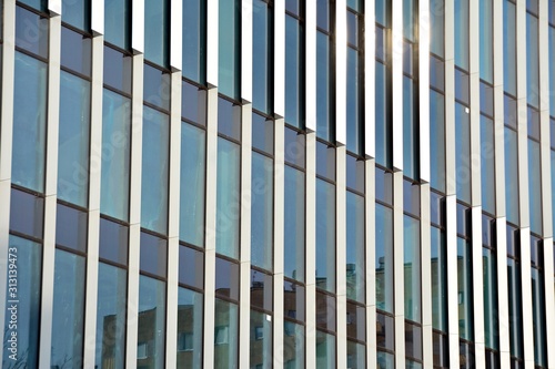 The windows of a modern building for offices. Business buildings architecture.