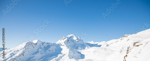 Natural scenery, snow on the high mountains in the cold winter of GRINDELWALD-FIRST TOP OF ADVENTURE SWITZERLAND of Europe and clear skies for skiing or walking. Beauty in Europe. © Bussarin