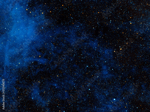 Bright blue cosmic nebula. Background texture. Elements of this image were furnished by NASA.