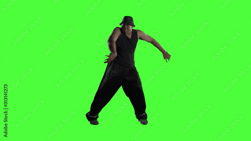 Male dancer doing hip hop dances on studio Male dancer doing hip hop dances on studio