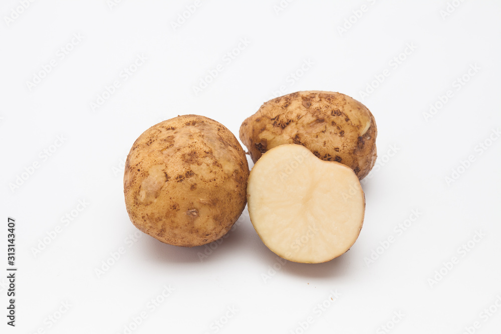 Sliced raw potatoes on a white background Sliced raw potatoes on a white background