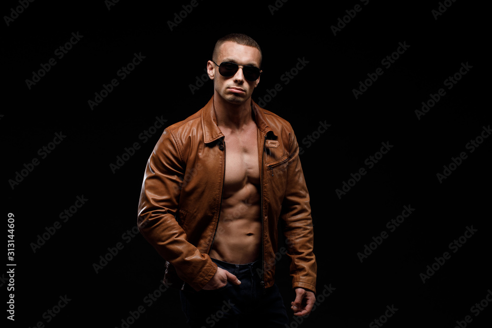 young handsome man, leather jacked on naked torso, emotional posing, lifestyle people concept young handsome man, leather jacked on naked torso, emotional posing, lifestyle people concept
