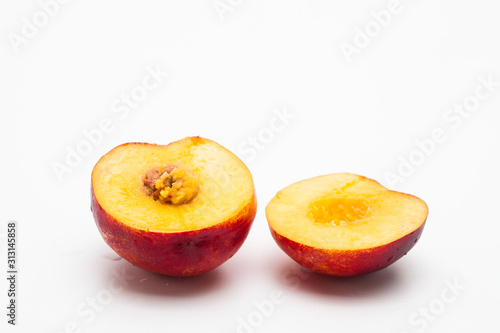 Sliced peaches on a white background