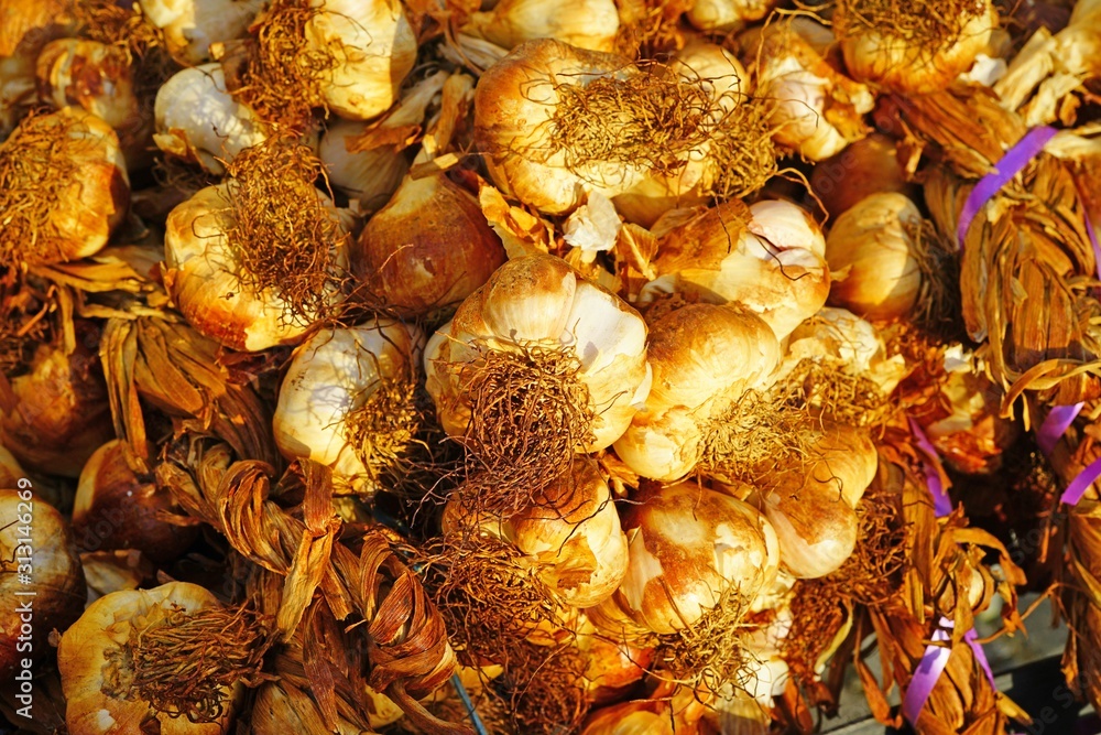 Dried heads of smoked garlic at a French farmers market Dried heads of smoked garlic at a French farmers market