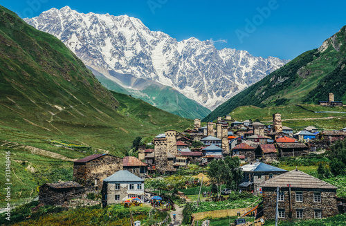 View of Mount Shkhara and buildings in Ushguli community villages in Svaneti region, Georgia
