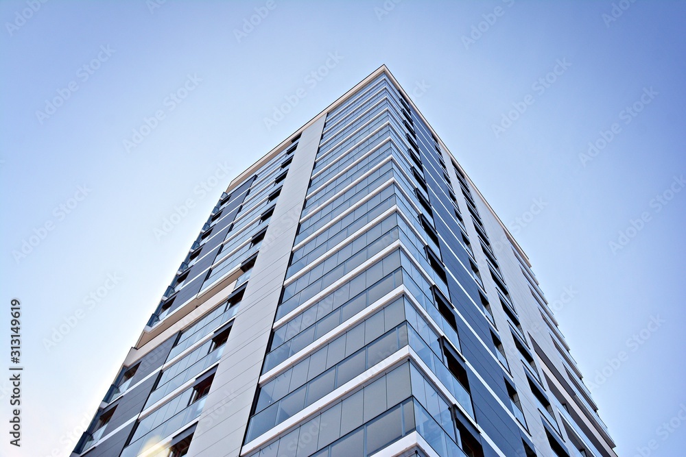 Modern apartment buildings on a sunny day with a blue sky. Facade of a modern apartment building. Modern apartment buildings on a sunny day with a blue sky. Facade of a modern apartment building.