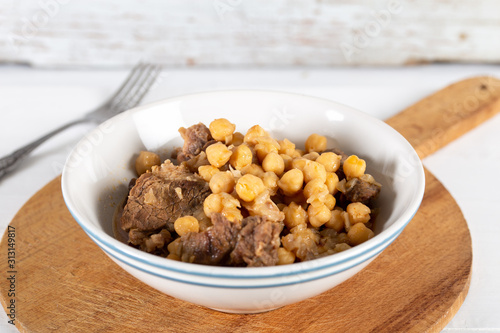 Chickpea stew dish on wooden board