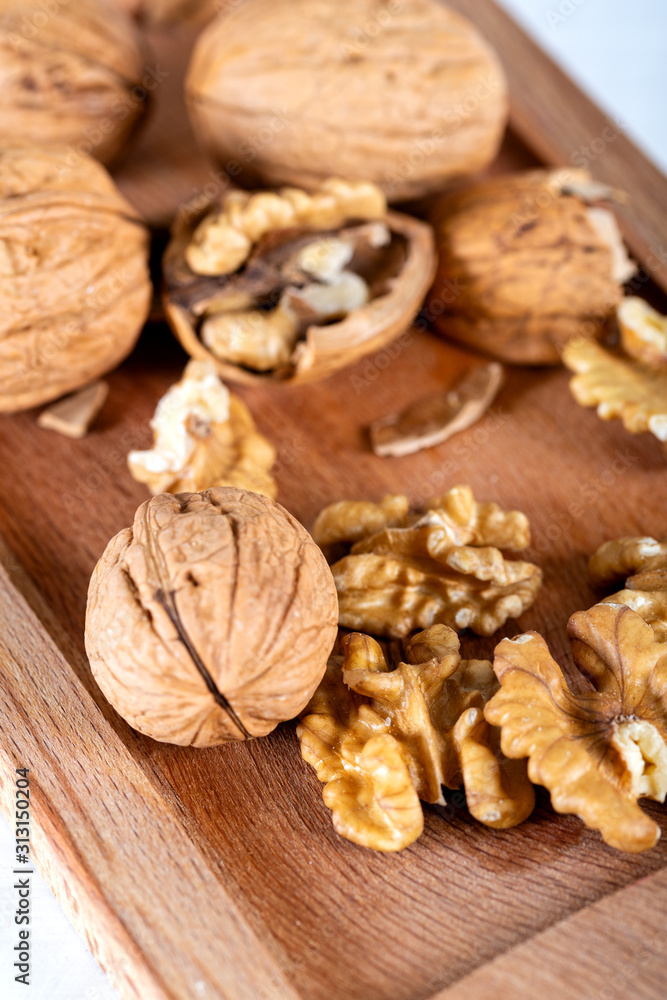 walnuts on wooden table walnuts on wooden table