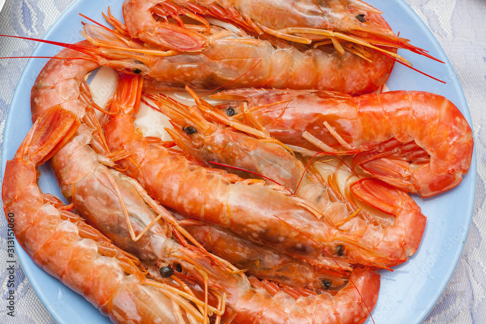 Fresh cooked lagoustines on the plate. Seafood menu. Fresh cooked lagoustines on the plate. Seafood menu.