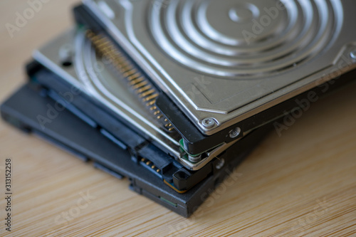 Close-up on three disk drives, hard disk, solid state, SATA, IDE