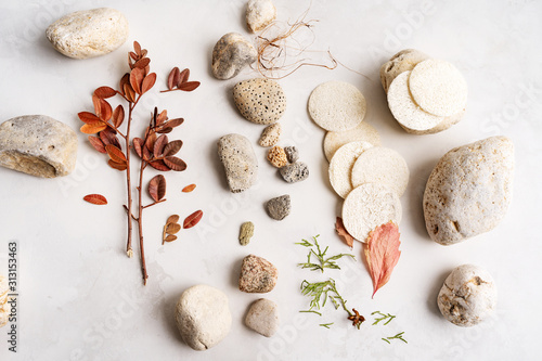 Natural background of minerals, sea, shell, stones, luff, loofah on light concrete surface with copy space for mocup organic cosmetics.
